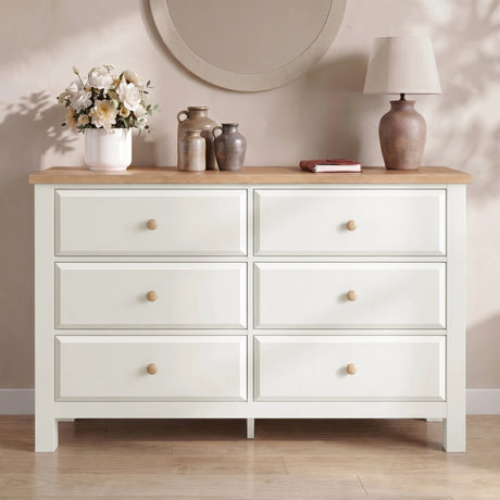 [White] Haven 6-drawer chest front view in a styled room with dried botanicals and decorative vase on oak top