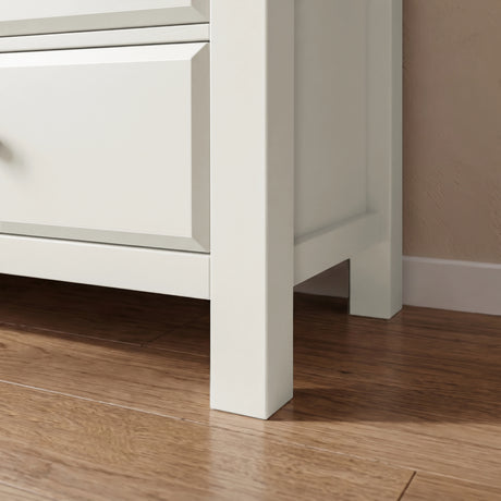 [White] Haven chest of drawers angled side profile view showing painted frame legs and minimal base detail