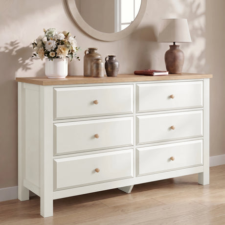 [White] Haven chest of drawers front view from low angle in a neutral room with dried floral arrangement on top