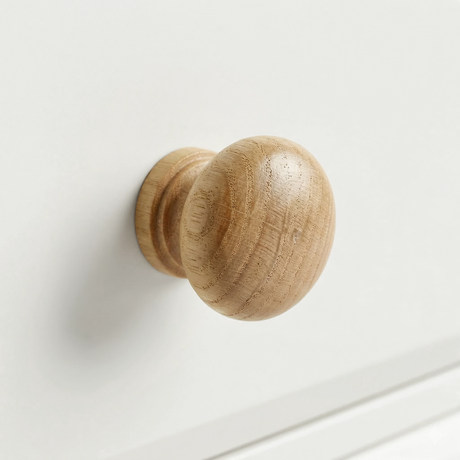 [White] Haven 5-drawer tall chest close-up of a round solid oak wooden knob handle on a painted drawer front