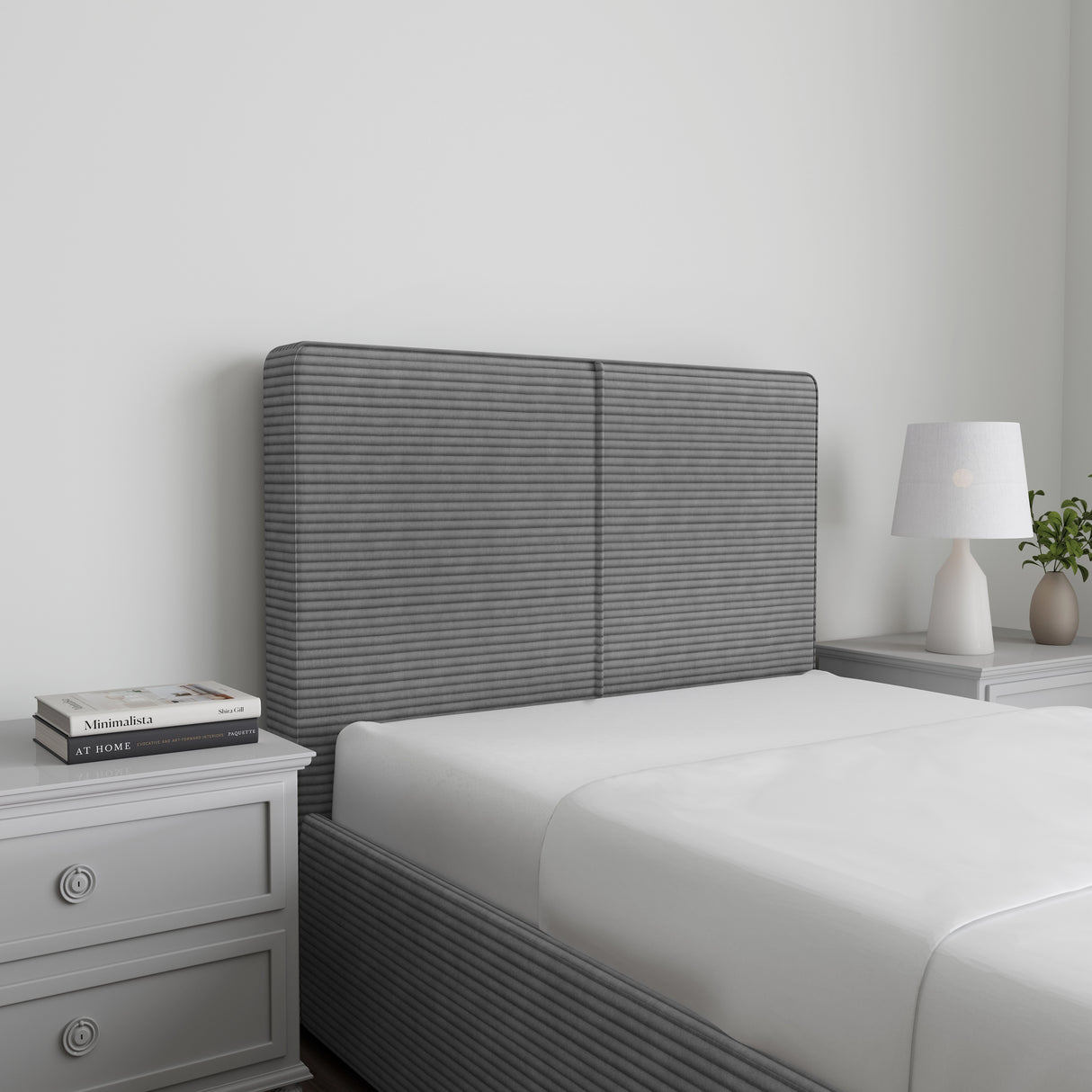 Corduroy ribbed velvet upholstered ottoman bed frame with storage in grey, shown in a modern bedroom with white bedding and matching nightstands.