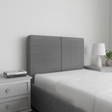 Corduroy ribbed velvet upholstered ottoman bed frame with storage in grey, shown in a modern bedroom with white bedding and matching nightstands.