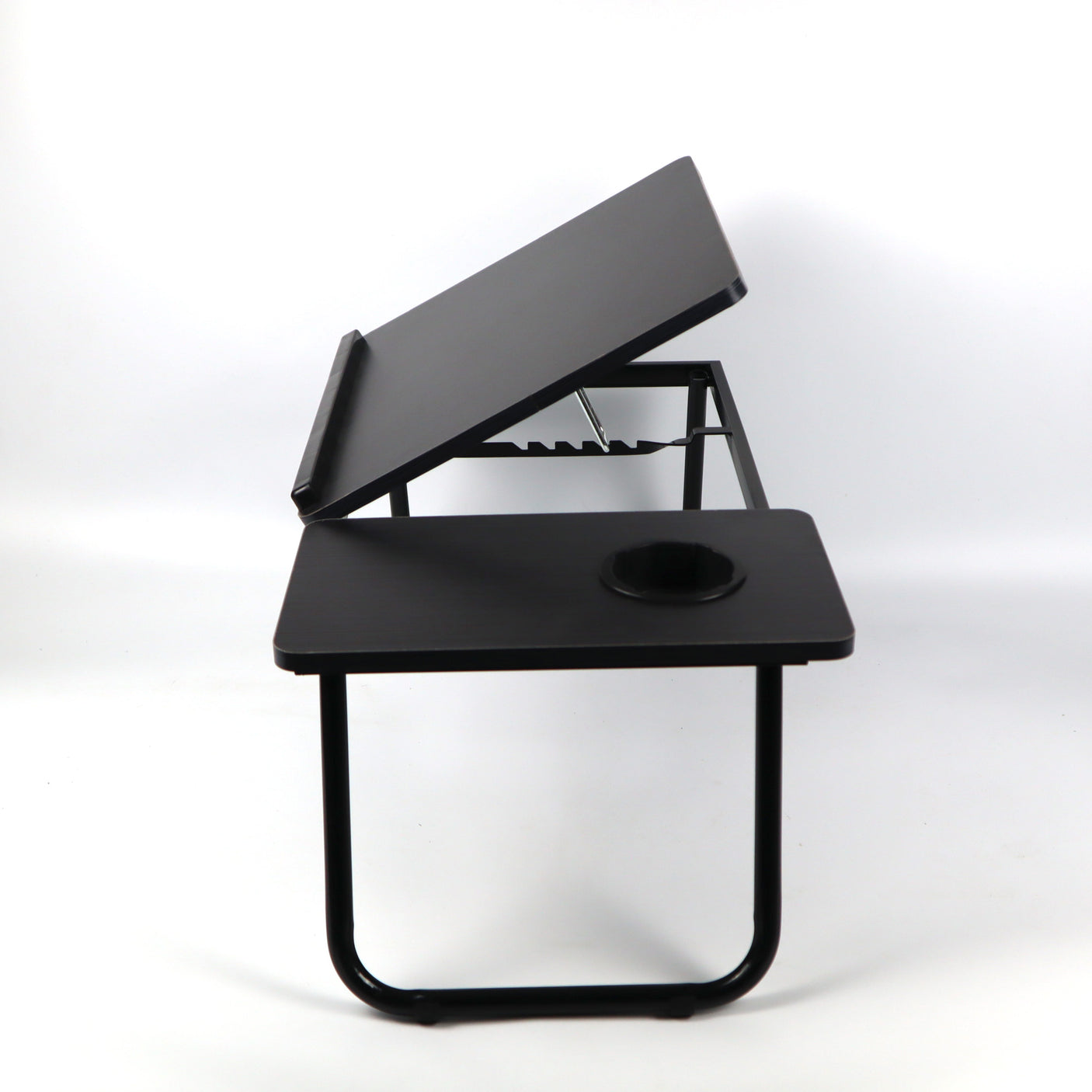 Black height-adjustable bed desk, perfect for working or reading comfortably while lying in bed or relaxing on the sofa.