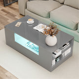 [Grey] grey high gloss coffee table with blue LED middle recess and cream rope-edge cushion sofa behind