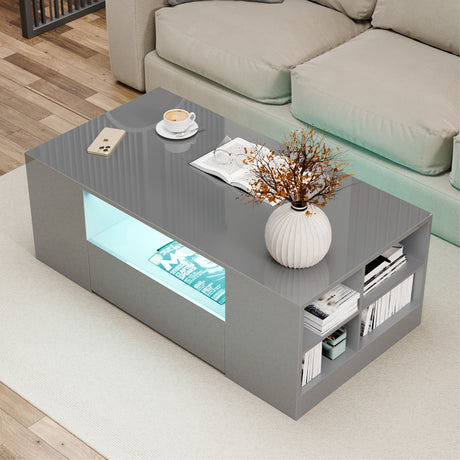 [Grey] grey high gloss coffee table with blue LED middle recess and cream rope-edge cushion sofa behind