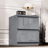 [Gray] nightstand with digital clock and lamp in a bedroom setting
