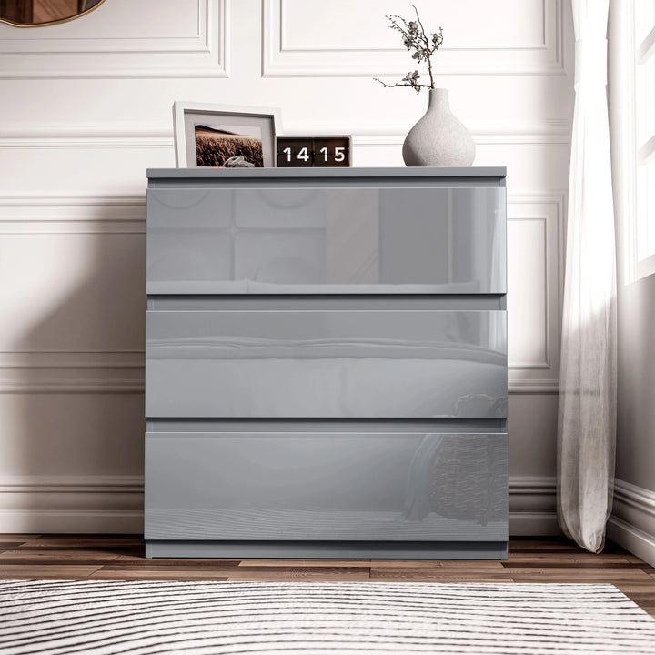 [Grey] high gloss 3 drawer chest closed view in bedroom with natural light through curtains