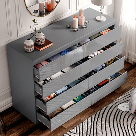 High Gloss Wide 8 Drawer Chest of Drawers in grey with open drawers showcasing organized clothes. Ideal bedroom dresser for modern storage solutions.