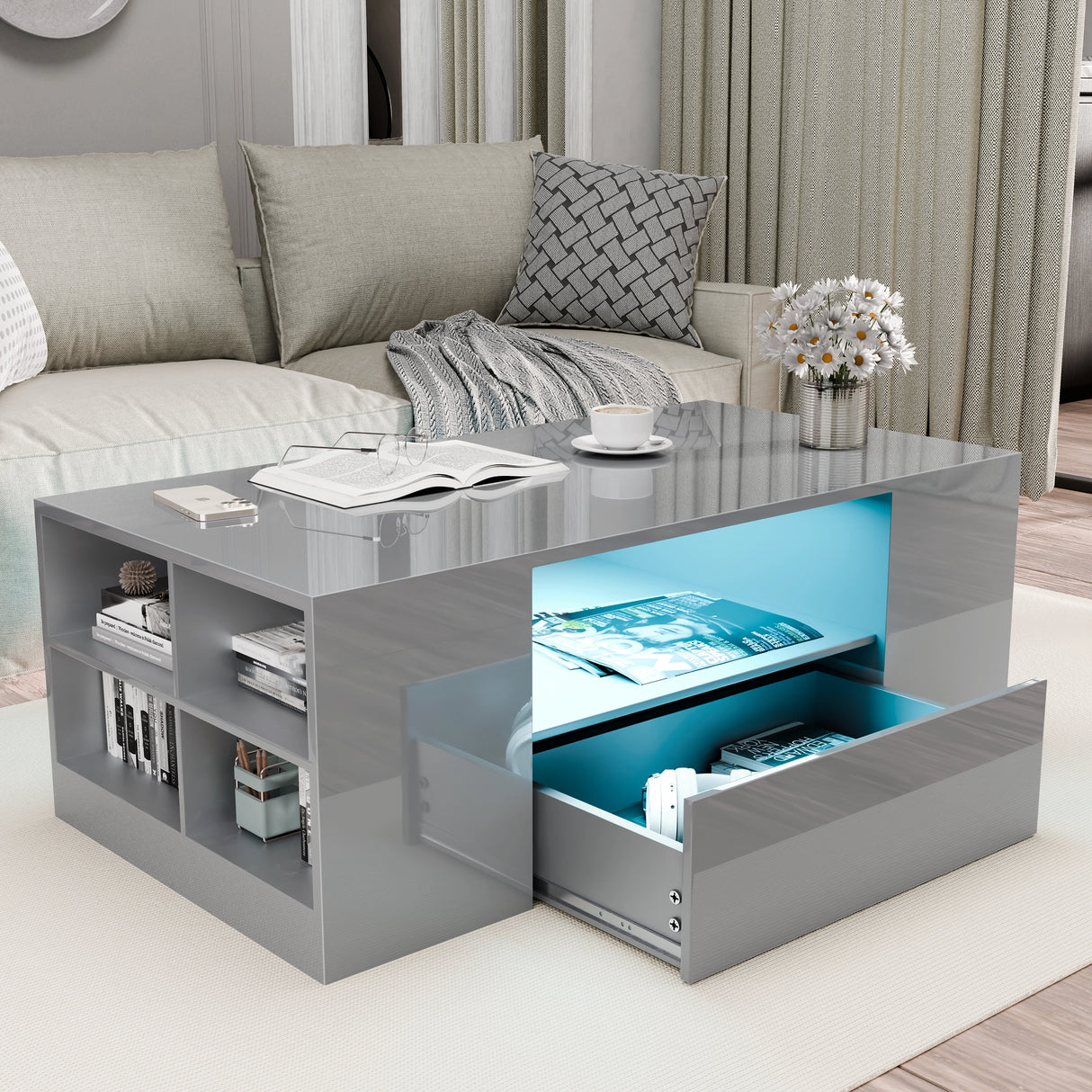 Grey high gloss coffee table with LED lights, open shelving, and drawers for modern living room storage solutions.