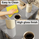 Grey high gloss LED side table with easy-to-clean surface, shown with a cloth and coffee cup for everyday use.