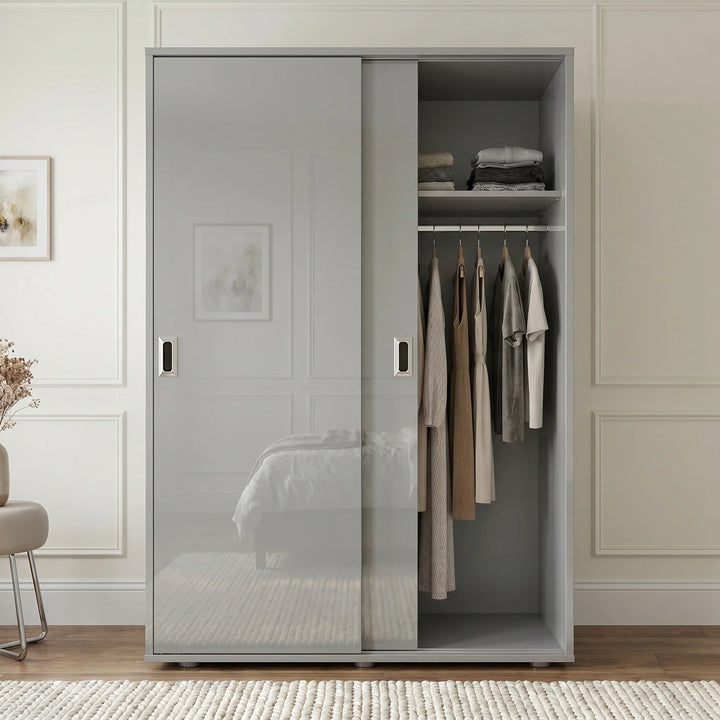 [High Gloss Grey] Torvek gloss wardrobe one door open in blue bedroom showing hanging rail, shelf and rolled bedding