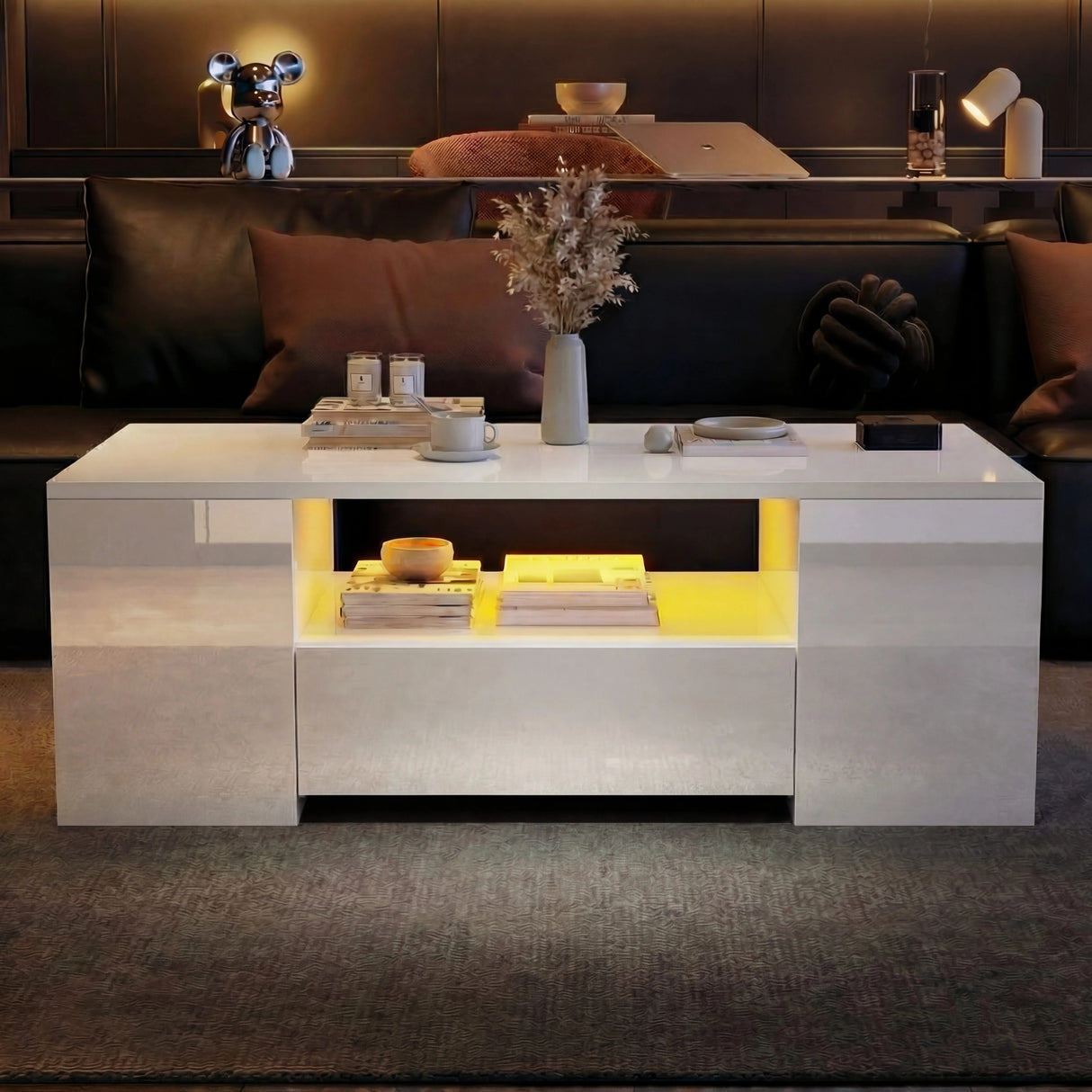 [White] Angled view of white gloss LED coffee table in front of dark leather sofa, yellow lighting on