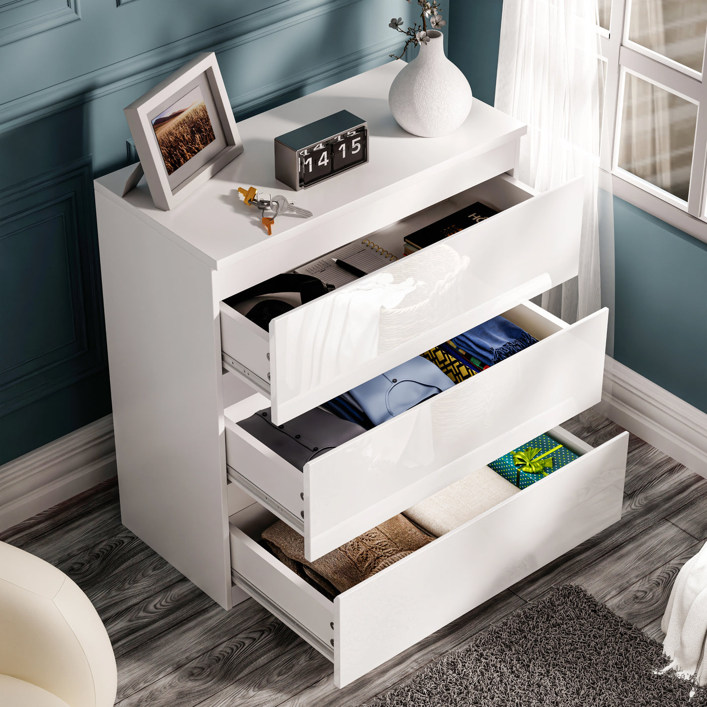 High Gloss 3 Drawer Chest of Drawers in white with handleless design, open drawers showing folded clothes, ideal for modern bedrooms.