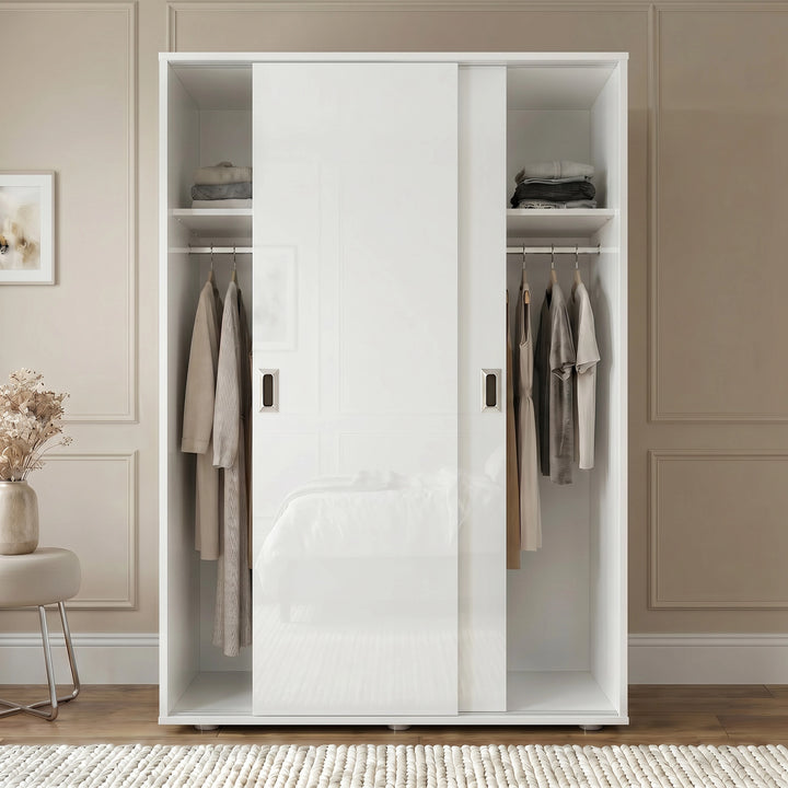 [High Gloss White] White wardrobe with clothes in a room with beige walls and a small table.