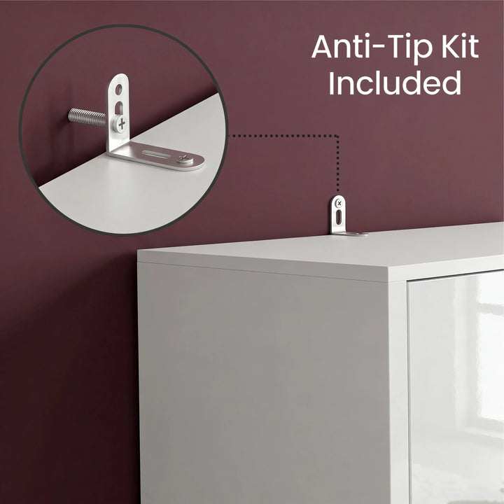 [High Gloss White] Anti-tip kit installation on a piece of furniture with a purple wall background