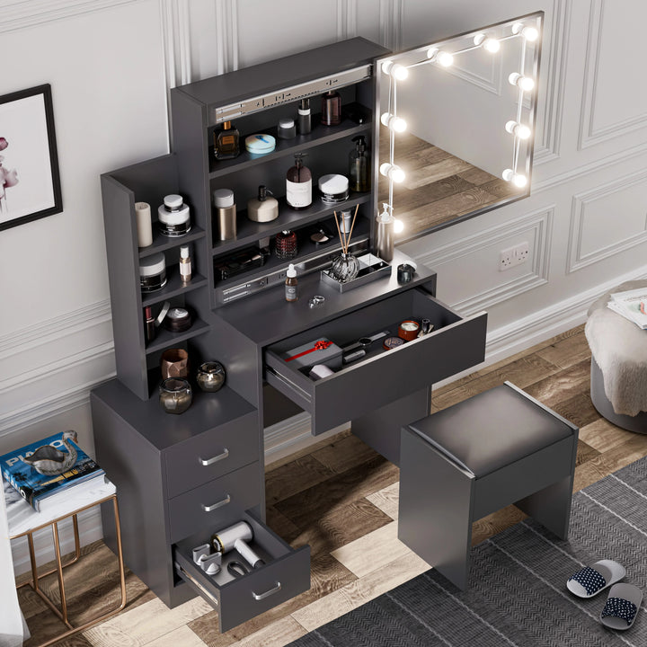 [Grey] Overhead view of dark grey Hollywood mirror dressing table with open desktop drawer and cushioned stool
