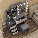 [Grey + Silver Grey] Overhead view of grey and silver grey Hollywood mirror dressing table with open desktop drawer