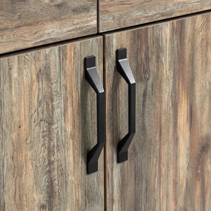 [Smokey Oak] Ironmere sideboard handle detail showing two black pulls on grain-patterned cupboard doors