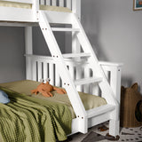 White wooden bunk bed with green bedding and a plush toy in a room.