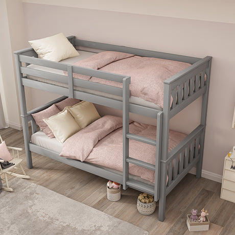 Kids grey bunk beds with stairs and quilt, offering a stylish and functional sleep space.
