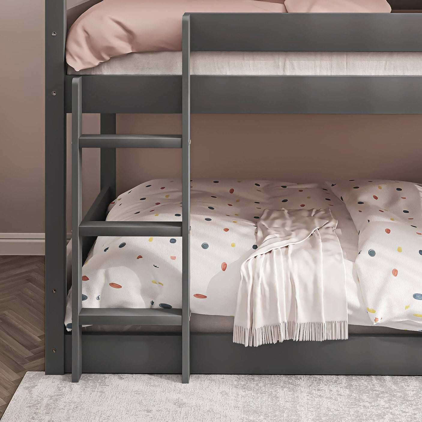 Close-up of lower ladder on dark grey triple bunk bed, showcasing child-safe design and sturdy construction.