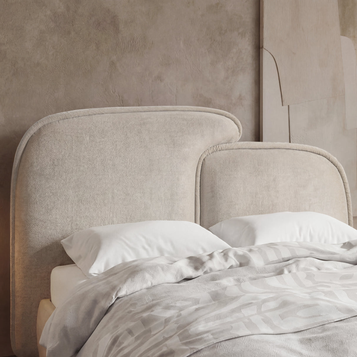 [King | Beige] Close-up of beige split headboard with stitched upholstery and gently curved upper edge of king bed frame