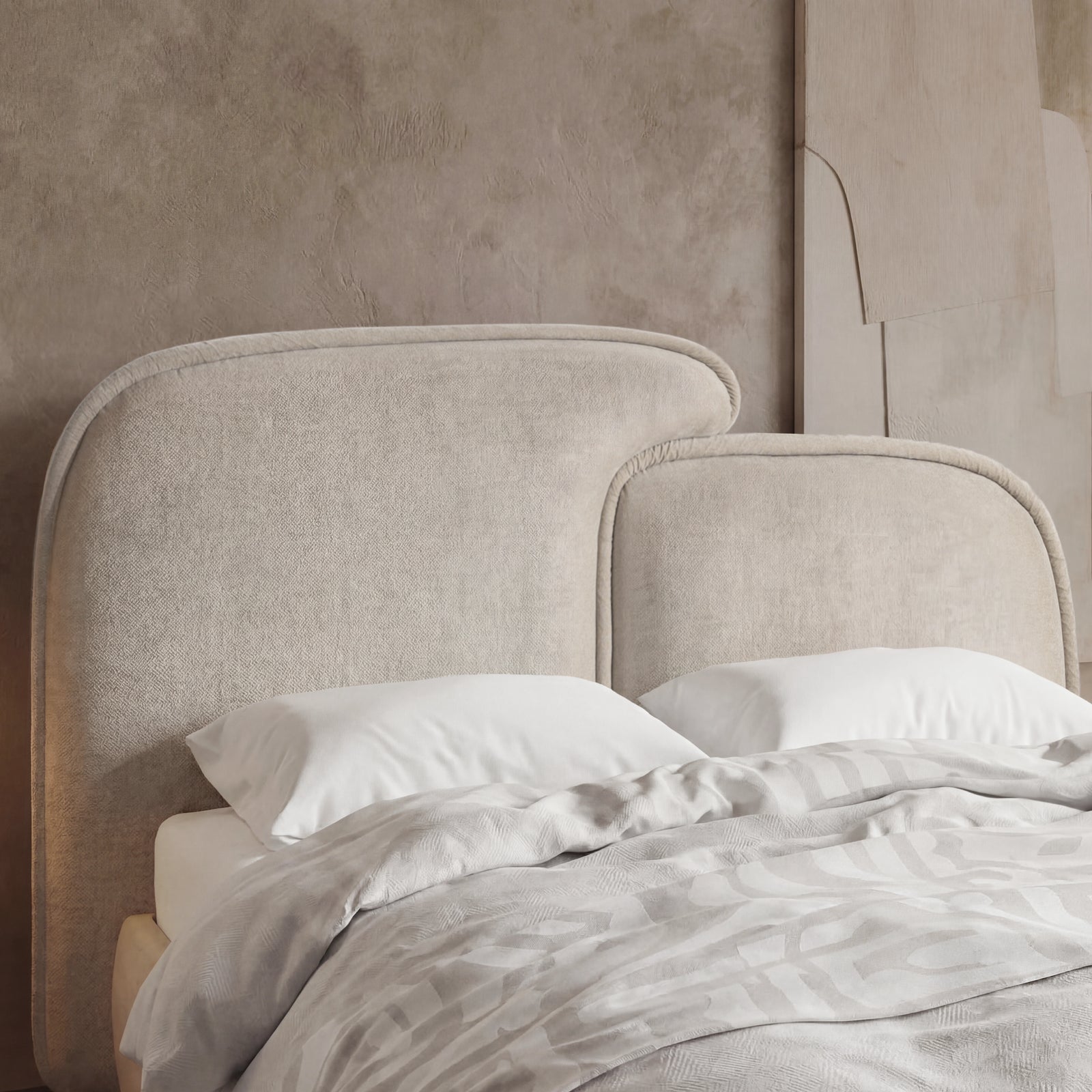 [King | Beige] Close-up of beige split headboard with stitched upholstery and gently curved upper edge of king bed frame