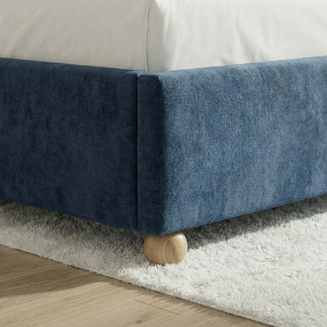 Velvet blue upholstered king bed frame featuring sturdy wooden slats for mattress support