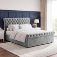 [King | Grey] Angled bedroom view with tufted headboard, rolled footboard, white bedding, bedside tables, and tall window