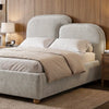 [King | Grey] Styled grey king ottoman bed frame with curved split headboard between nightstands and lamps