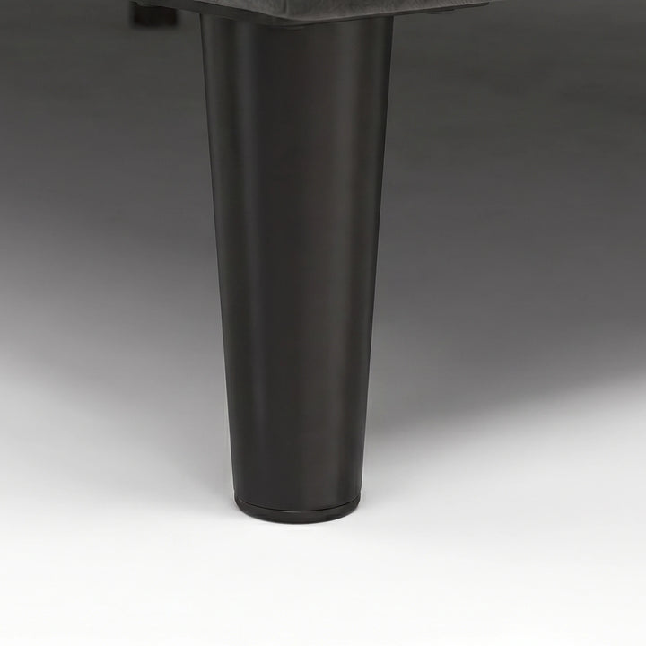 [King | Grey] Velvet Bed Frame close-up of tapered dark cylindrical leg on plain background