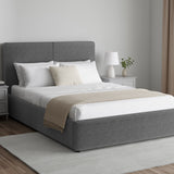 Corduroy ribbed velvet upholstered ottoman bed frame with storage in dark grey, shown in a modern bedroom with white bedding and side tables.