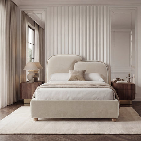 Centered king size upholstered bed frame with padded backrest, symmetrical pillows, and balanced bedside lighting