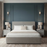 King size ottoman bed grey with upholstered headboard and footboard placed in the middle of a modern room