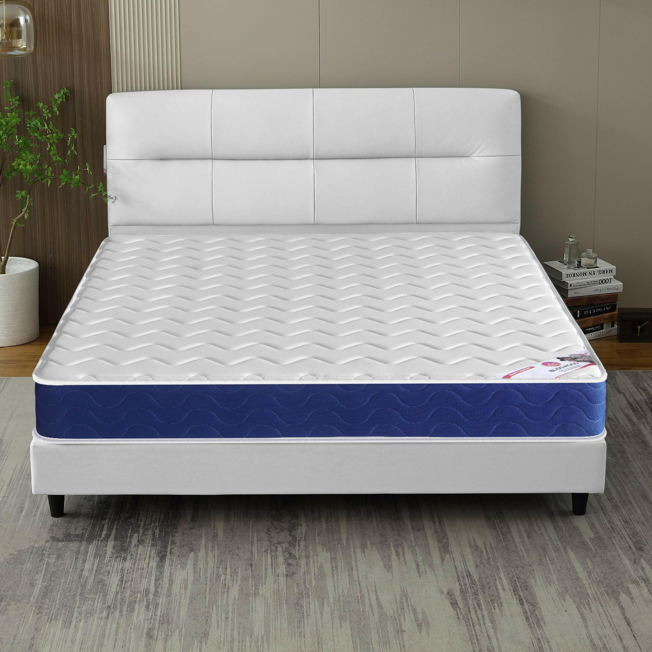 King size pocket sprung mattress with a modern quilted design, displayed on a stylish white bed