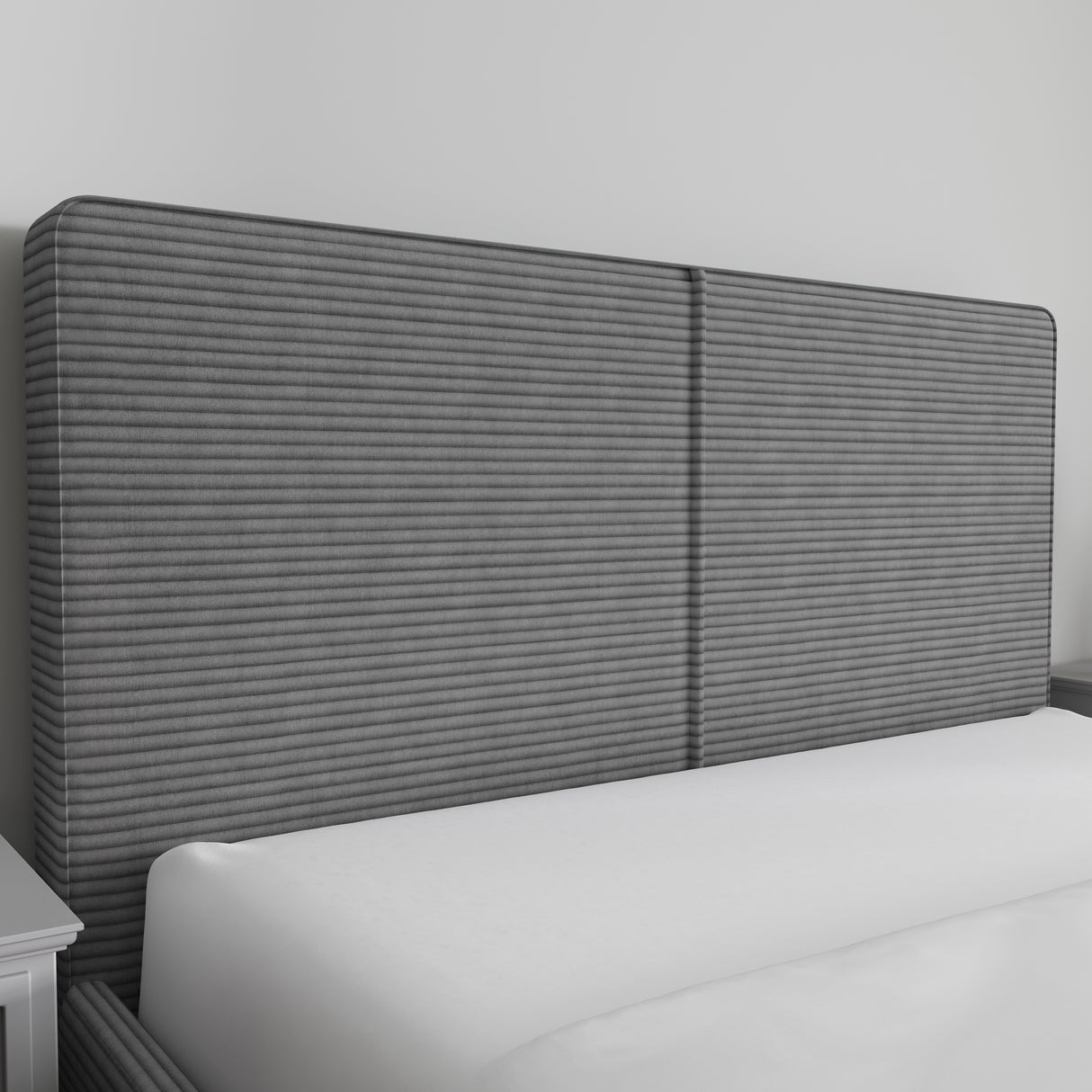 Corduroy ribbed velvet upholstered ottoman bed frame in dark grey with a tall, textured headboard. Ideal for modern bedrooms with hidden storage.