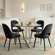 [Black | Clear] Kyvon round glass dining set with 110cm round table, chrome legs and 4 black chairs in a dining room
