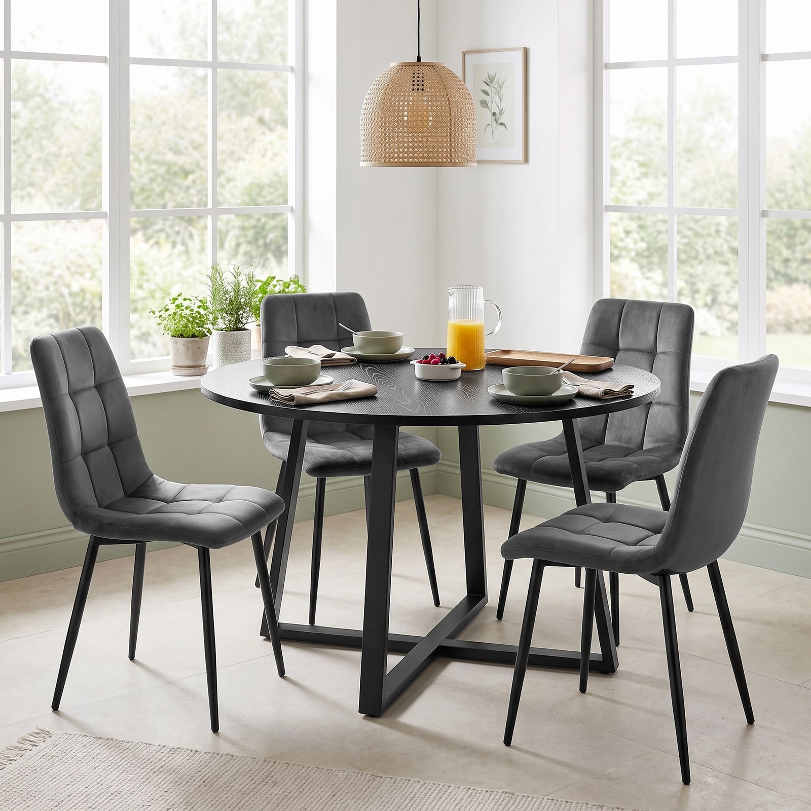 [Dark Grey | Black Wood] Kyvon round dining table set with 4 dark grey velvet chairs in a dining room
