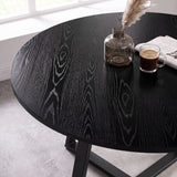[Grey | Black Wood] Close-up of Kyvon round dining table set's black wood-effect tabletop and black base