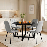 [Light Grey | Black Wood] Kyvon round dining table set in panelled dining room with four light grey velvet chairs