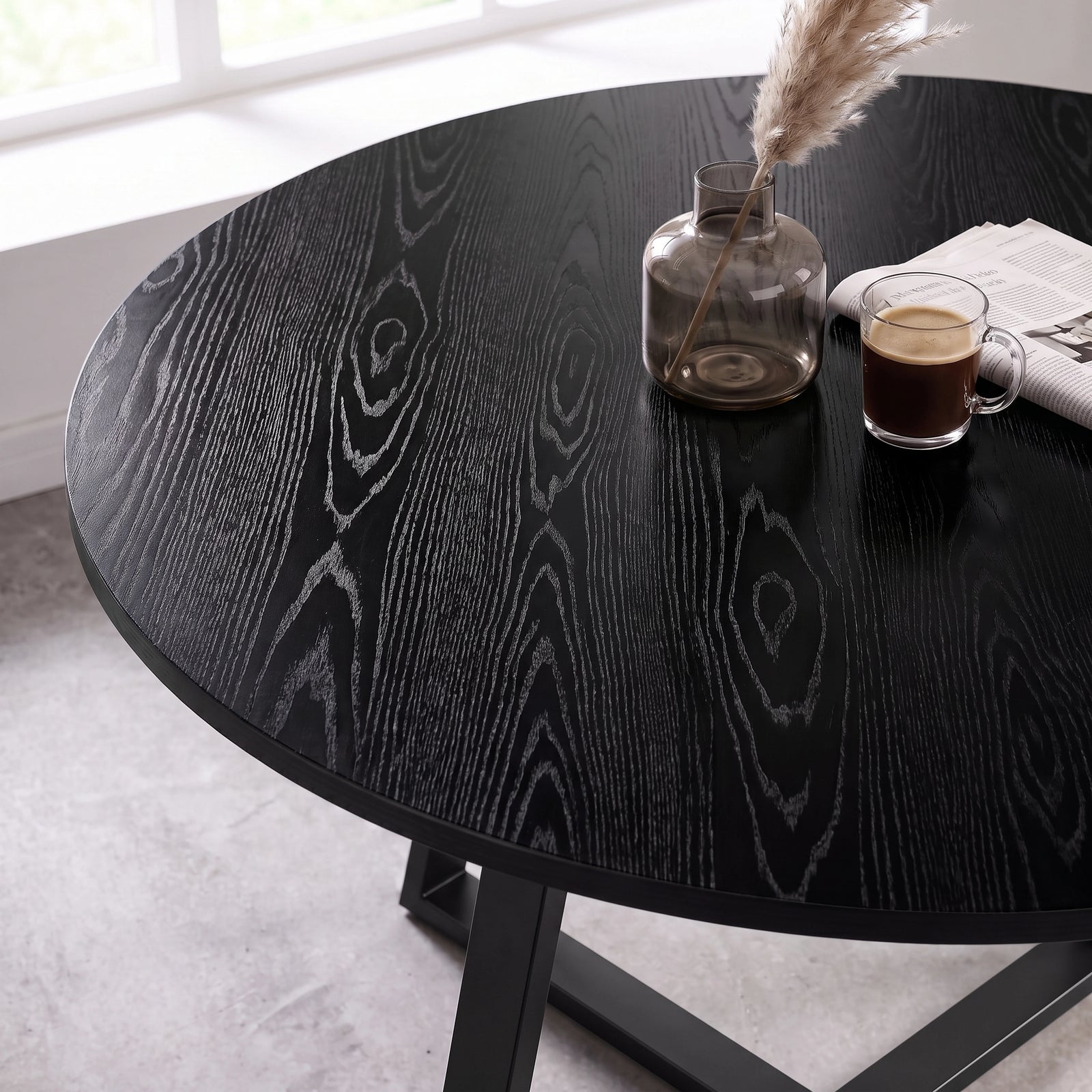 [Light Grey | Black Wood] Close-up of Kyvon round dining table top showing black wood tabletop surface