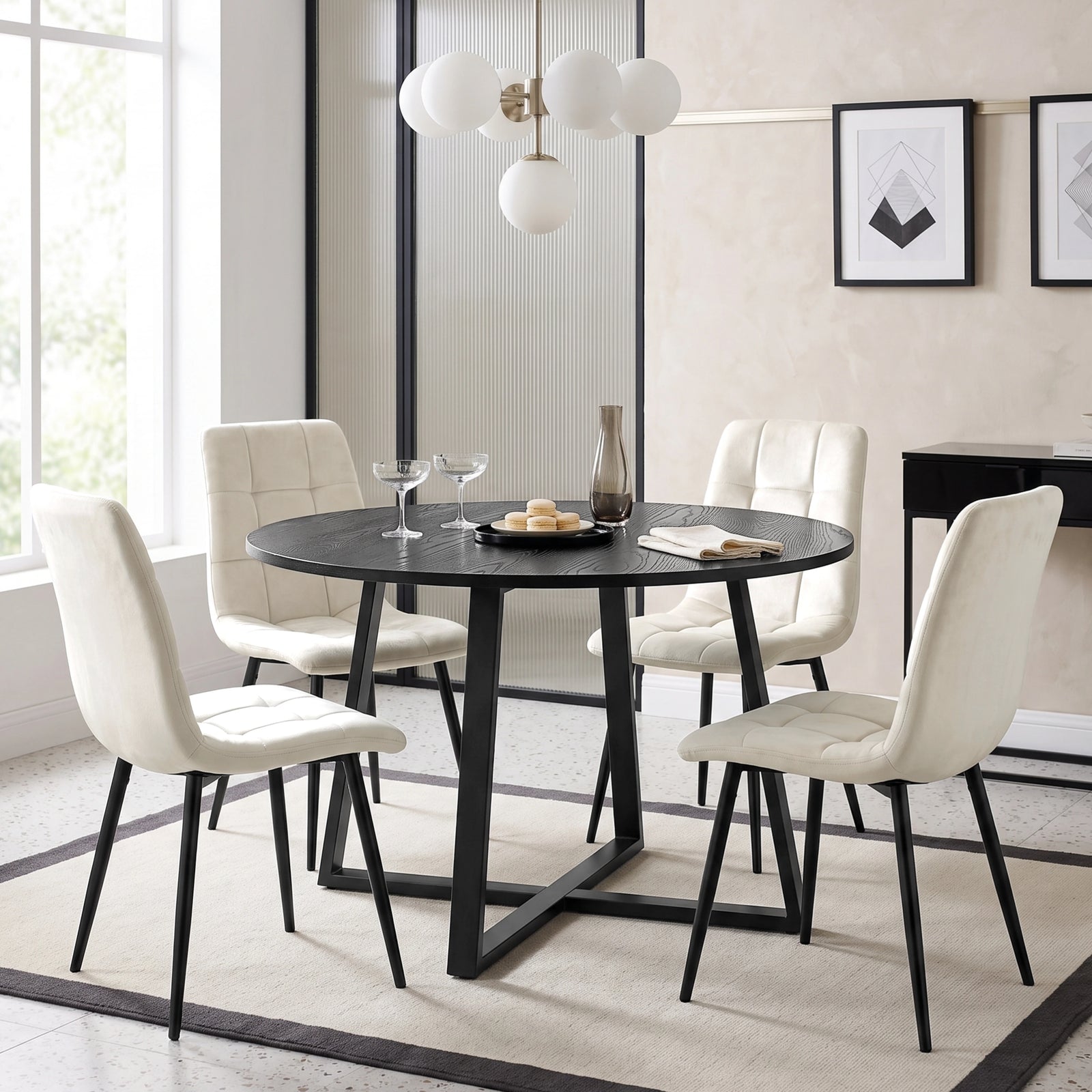 [Cream | Black Wood] Kyvon round dining table set with 4 cream velvet chairs in a styled dining room