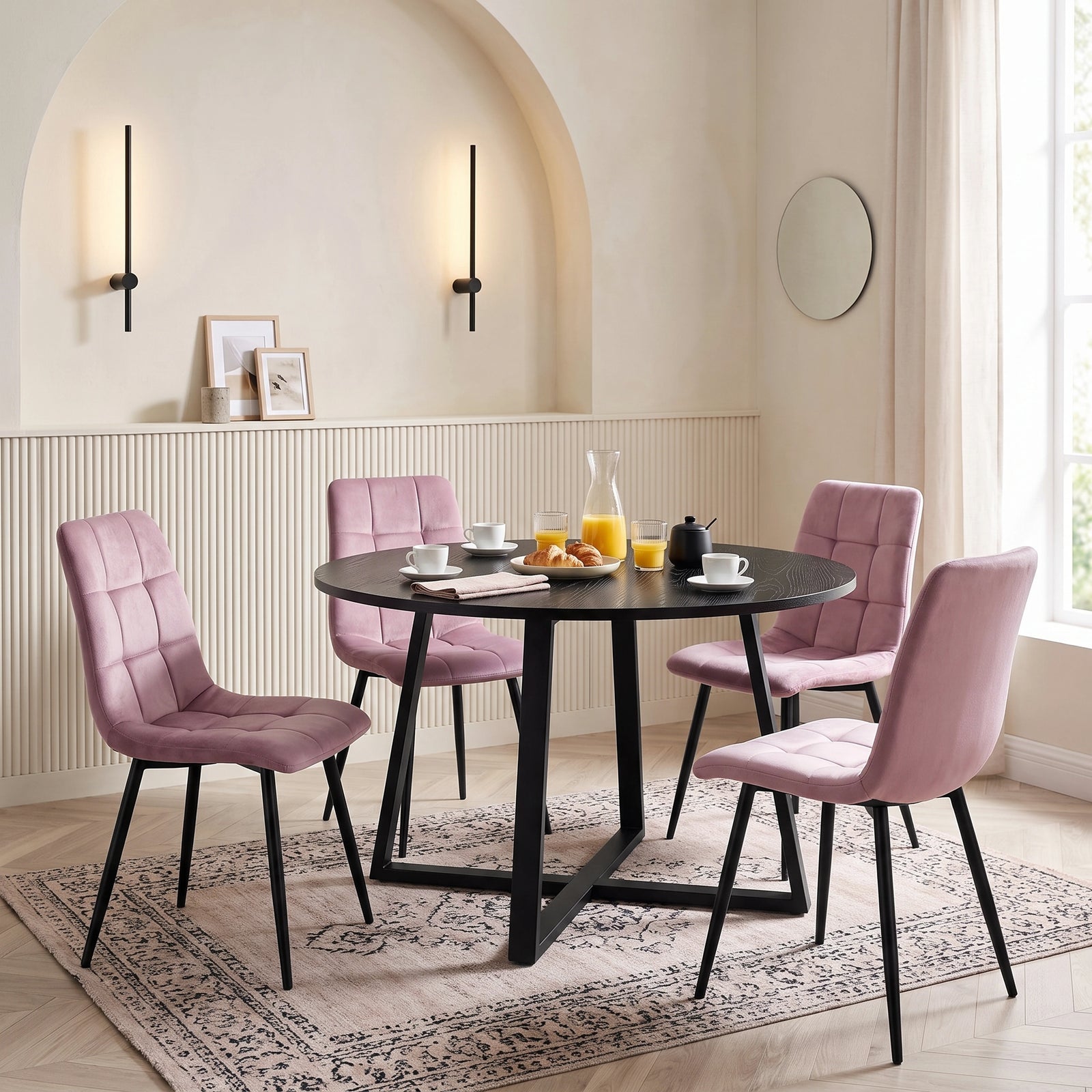 [Pink | Black Wood] Kyvon round dining table set in arched-wall dining room with four pink velvet chairs