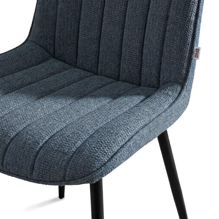 [Blue] Kyvon close-up of blue upholstered fabric vertical chair seat with black metal legs
