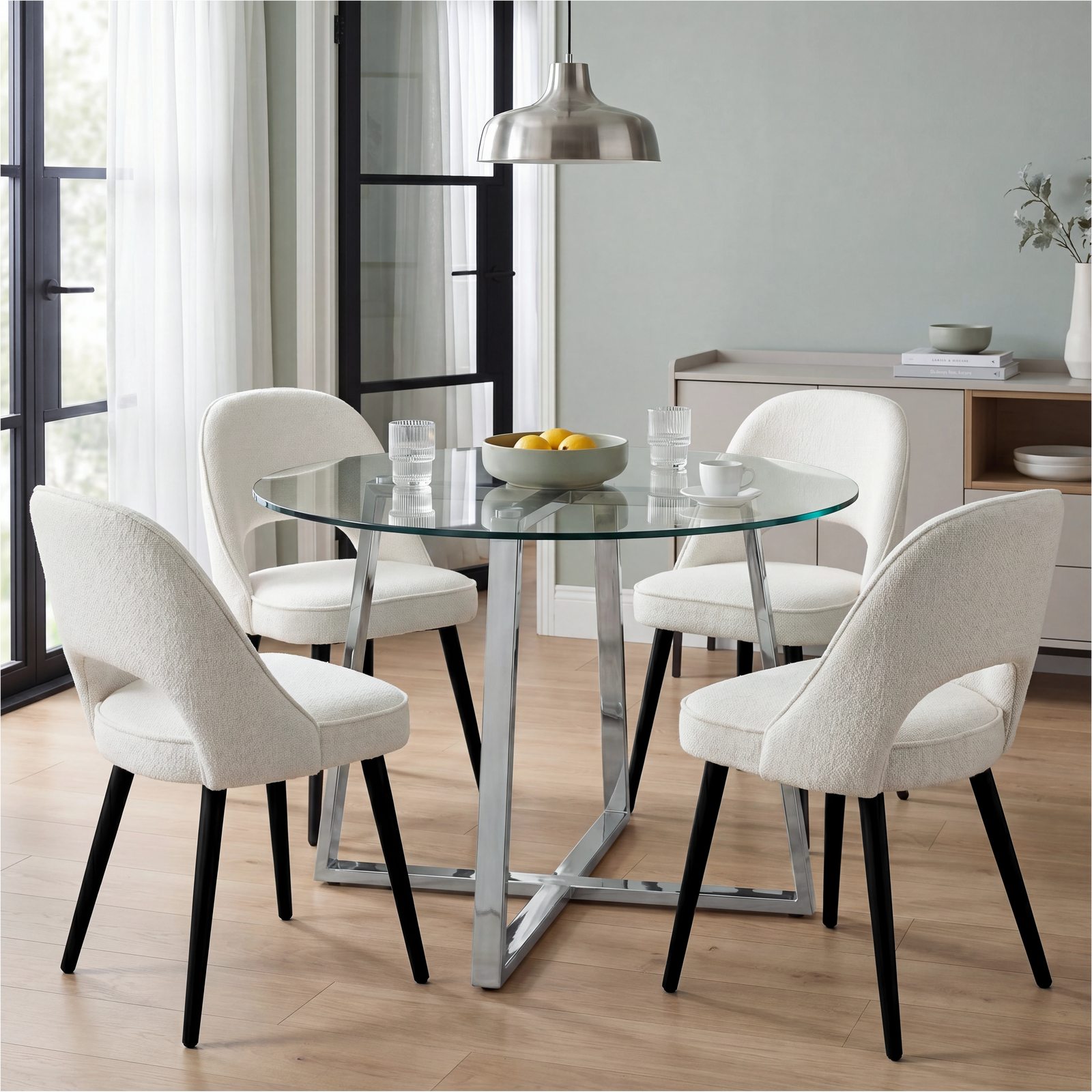 [Cream | Clear] Kyvon round glass dining set with 110cm round table, chrome legs and 4 cream chairs in a dining room
