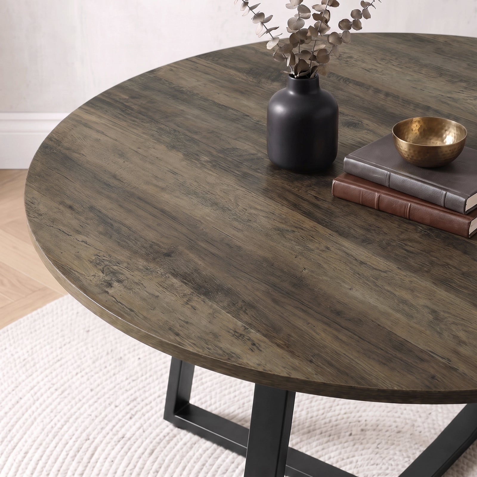 [Blue | Dark Wood] Close-up of Kyvon round dining table set's dark wood tabletop and black base