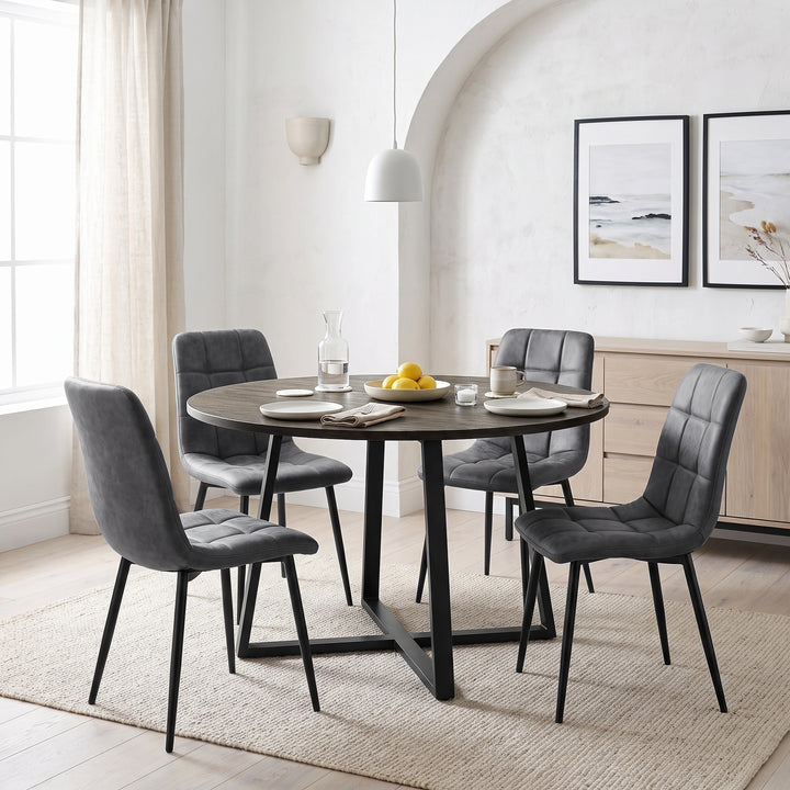 [Grey | Dark Wood] Kyvon round dining table set with 4 grey suede chairs in an arched dining room