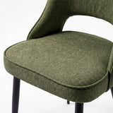 [Green | Tinted] Close-up of the 4 seater Kyvon green upholstered fabric comfy chair seat with black metal legs