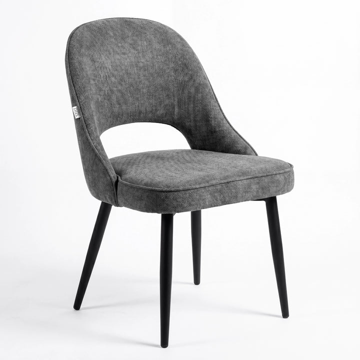 [Grey | Clear] Kyvon grey upholstered fabric comfy curve chair angled view with rounded back and cushioned seat