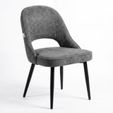 [Grey] Kyvon grey upholstered fabric comfy curve chair angled view with rounded back and cushioned seat